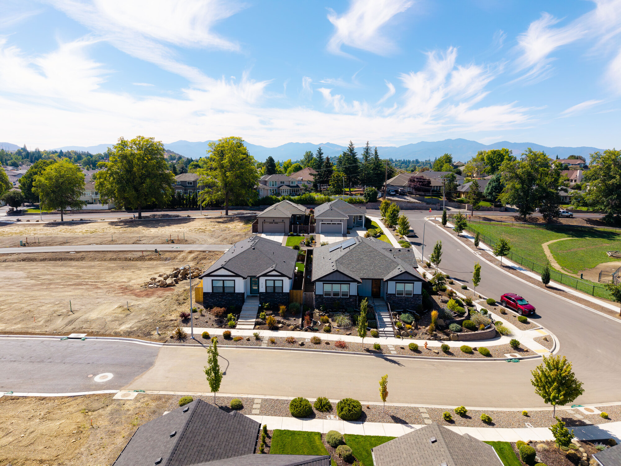 Aerial photograph of newly built homes with mountains in the distance